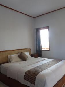Postel nebo postele na pokoji v ubytování Geyu House