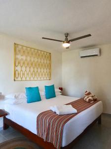 Postel nebo postele na pokoji v ubytování Hotel Puerto Holbox Beach Front