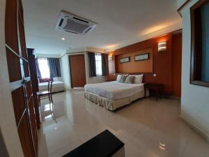 Postel nebo postele na pokoji v ubytování Wonderland Private Chalet at Port Dickson