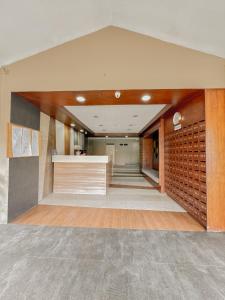 a large room with a wall of wine racks at ANIA CONDO STAY in Mactan