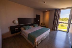 Postel nebo postele na pokoji v ubytování Hotel Ciudad de Ponferrada, Ascend Hotel Collection