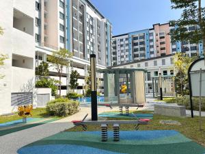 a park with a playground in a city at Leisure Home - 7pax Camping Theme in Kampong Lobok