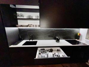 a kitchen with a sink and a counter withtools at Newly Renovated 1BR in Kaunas Downtown Central Location Fast WiFi in Kaunas