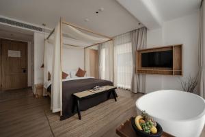 Katil atau katil-katil dalam bilik di Guizhou Kaili Leli Designer Hotel