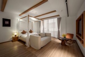Katil atau katil-katil dalam bilik di Guizhou Kaili Leli Designer Hotel