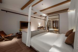 Katil atau katil-katil dalam bilik di Guizhou Kaili Leli Designer Hotel