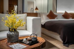 Katil atau katil-katil dalam bilik di Guizhou Kaili Leli Designer Hotel