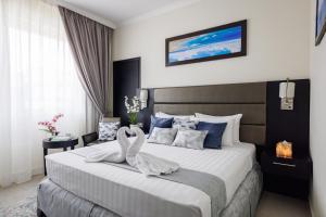 Katil atau katil-katil dalam bilik di The Royal Riviera Hotel Doha