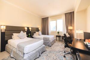 Katil atau katil-katil dalam bilik di The Royal Riviera Hotel Doha