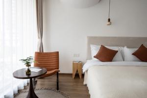 Katil atau katil-katil dalam bilik di Guizhou Kaili Leli Designer Hotel