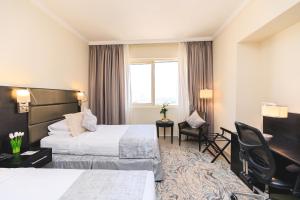 Katil atau katil-katil dalam bilik di The Royal Riviera Hotel Doha