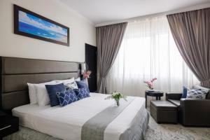 Katil atau katil-katil dalam bilik di The Royal Riviera Hotel Doha