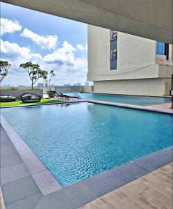 a swimming pool in the middle of a building at 3BR-Countryroad-Paradigm Residence by Guesthouse-6-8Pax in Johor Bahru