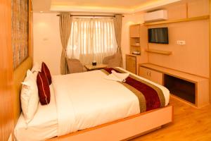 Voodi või voodid majutusasutuse Hotel Elegant Kathmandu Inn toas