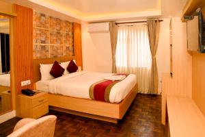 Voodi või voodid majutusasutuse Hotel Elegant Kathmandu Inn toas