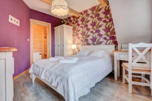 Posteľ alebo postele v izbe v ubytovaní Apartamenty Tatra View Kościelisko