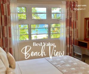 a bedroom with a bed and a window with the words best value beach view at Panorama Guesthouse Apartments Beau Vallon Beach in Beau Vallon +79 photos