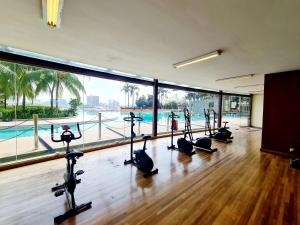 a gym with a row of exercise bikes in a room at 4 Bedrooms USJ Summit Damen Segi Taipan Sunway University Monash Sunway Medical Sunway Pyramid Lagoon in Kampong Penaga