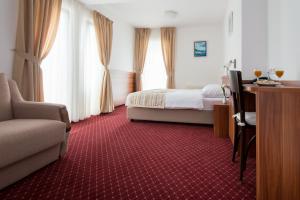 Postel nebo postele na pokoji v ubytování Hotel Villa Nova