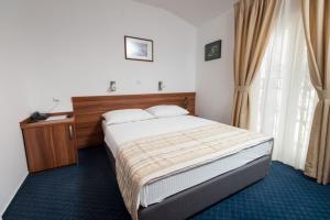 Postel nebo postele na pokoji v ubytování Hotel Villa Nova