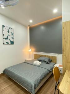 Ένα ή περισσότερα κρεβάτια σε δωμάτιο στο Happy Hotel Bình Tân +30 φωτογραφίες