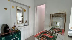 a white room with a mirror and a table at Comfort Accommodation Suite & Le Camere in Bergamo +135 photos