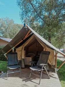two chairs sitting in front of a tent at Safari tent XS - Camping Belle-Vue in Berdorf