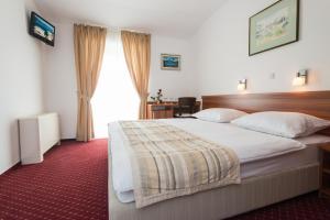 Postel nebo postele na pokoji v ubytování Hotel Villa Nova