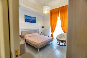 A bed or beds in a room at Antonella home b&b