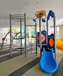 a playground with a slide at 3BR-Sora-Paradigm Residence by Guesthouse-8-9Pax in Johor Bahru