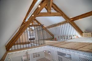 a loft conversion with a gambrel roof with a metal cage at Gîte le Grenier GRAY in Gray