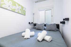 En eller flere senge i et værelse på Apartamento Coral