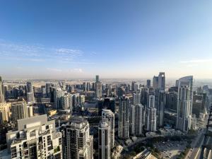 an aerial view of a city with tall buildings at 64th floor Skyline Pool with Burj Khalifa View in Paramount Hotel Midtown in Dubai
