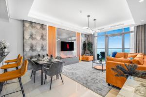a living room with a table and a couch at 64th floor Skyline Pool with Burj Khalifa View in Paramount Hotel Midtown in Dubai