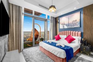 a bedroom with a bed and a large window at 64th floor Skyline Pool with Burj Khalifa View in Paramount Hotel Midtown in Dubai +37 photos
