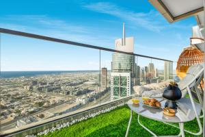 a view of the city from the balcony of a building at 64th floor Skyline Pool with Burj Khalifa View in Paramount Hotel Midtown in Dubai