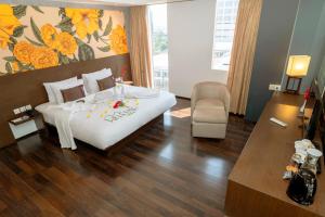Postel nebo postele na pokoji v ubytování Akmani Hotel Jakarta