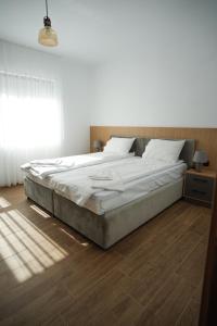 Ένα ή περισσότερα κρεβάτια σε δωμάτιο στο Sun City Apartment