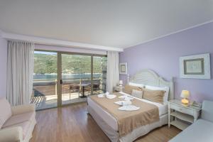 Posteľ alebo postele v izbe v ubytovaní San Nicolas Resort Hotel