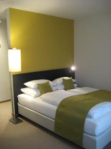 Postel nebo postele na pokoji v ubytování Hotel Kapellenberg