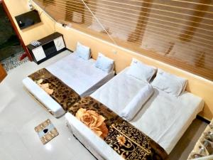 Posezení v ubytování UNIQDO Inn Tomok