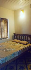 Postel nebo postele na pokoji v ubytování Verdant Vagamon Cottage