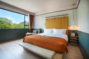 Postel nebo postele na pokoji v ubytování Shenzhen Xili Ruixi Hotel