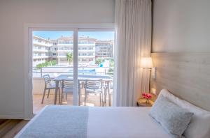 Posteľ alebo postele v izbe v ubytovaní Pierre & Vacances Estartit Playa