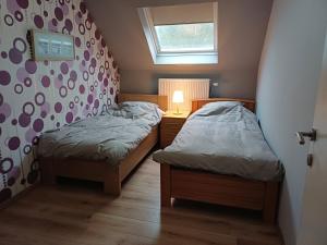 Postel nebo postele na pokoji v ubytování Vakantiewoning De Zilverberk