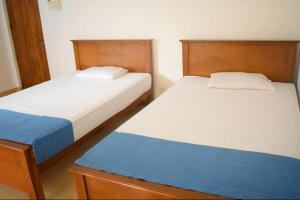 Letto o letti in una camera di Punchi Walawwa - Guest House - Holiday Bungalow