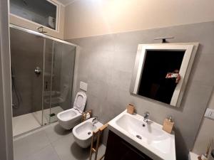 a person taking a picture of a bathroom at Bosazza 20 in Parma