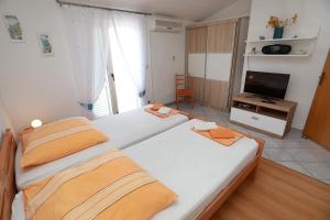 Katil atau katil-katil dalam bilik di Apartments Mandaric