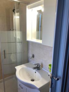 a bathroom with a sink and a shower and a mirror at SIMPLY INN close to TIVOLI in Marcellina +45 photos