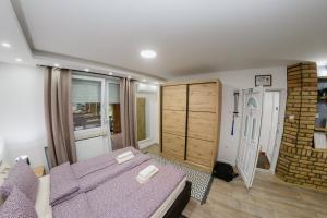 Postel nebo postele na pokoji v ubytování Guest House LILA